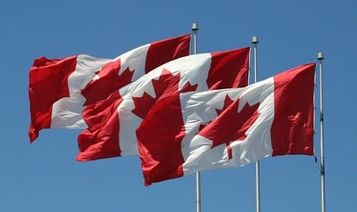 three canadian flags in the row